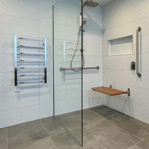 Accessible wetroom with shower seat and grab bars