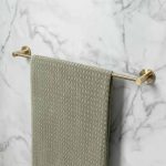 brass towel rail with towel