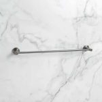 grey round towel rail shown on marble wall